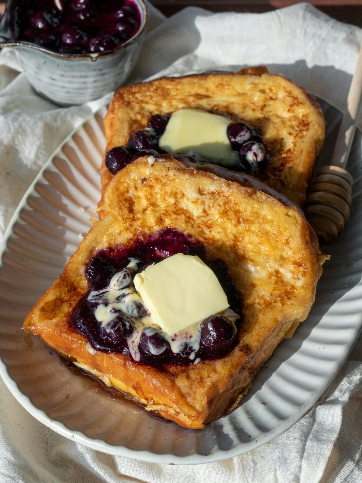 Thick French toast with blueberries and butter