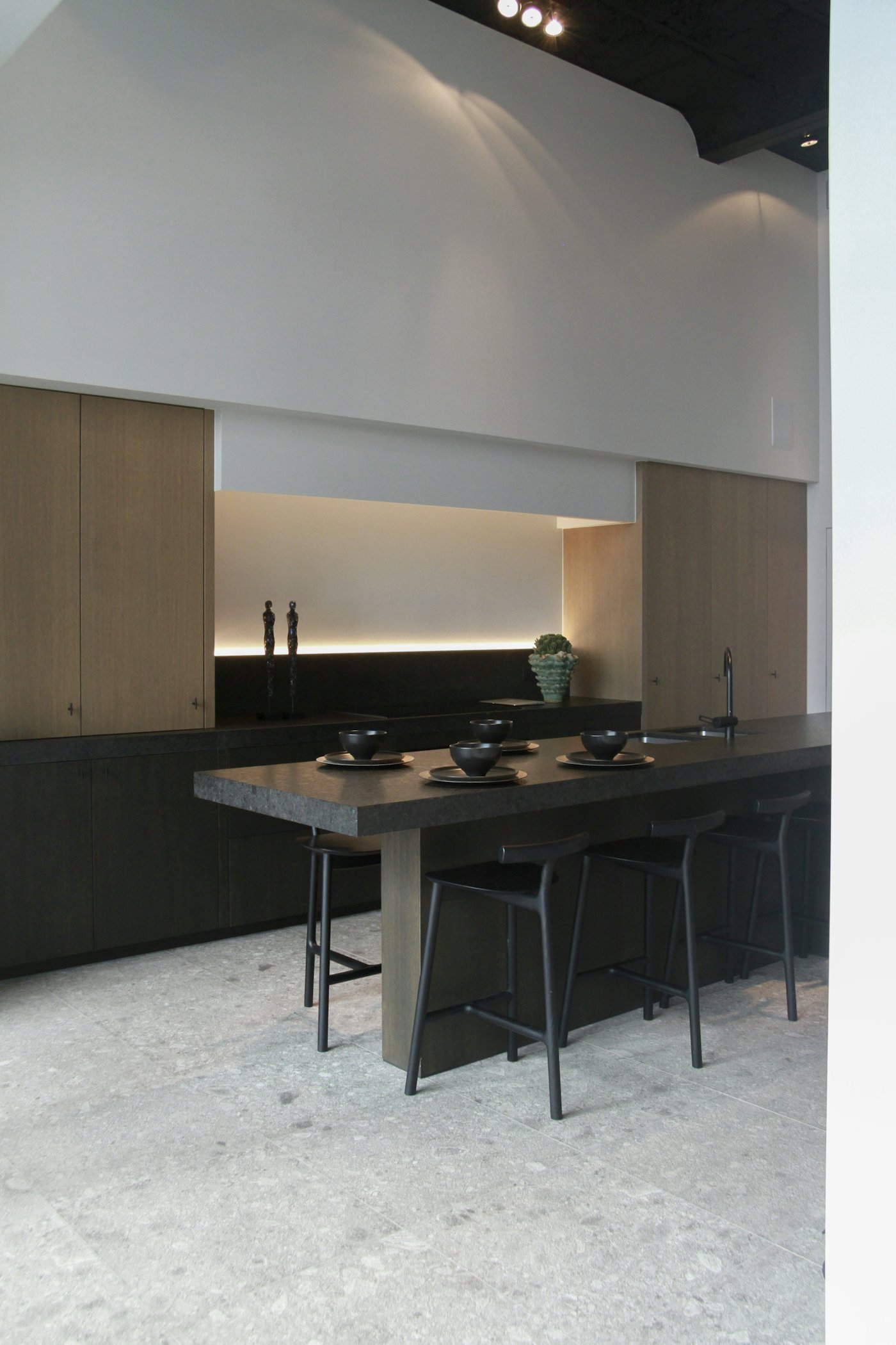 Dark kitchen with warm lighting