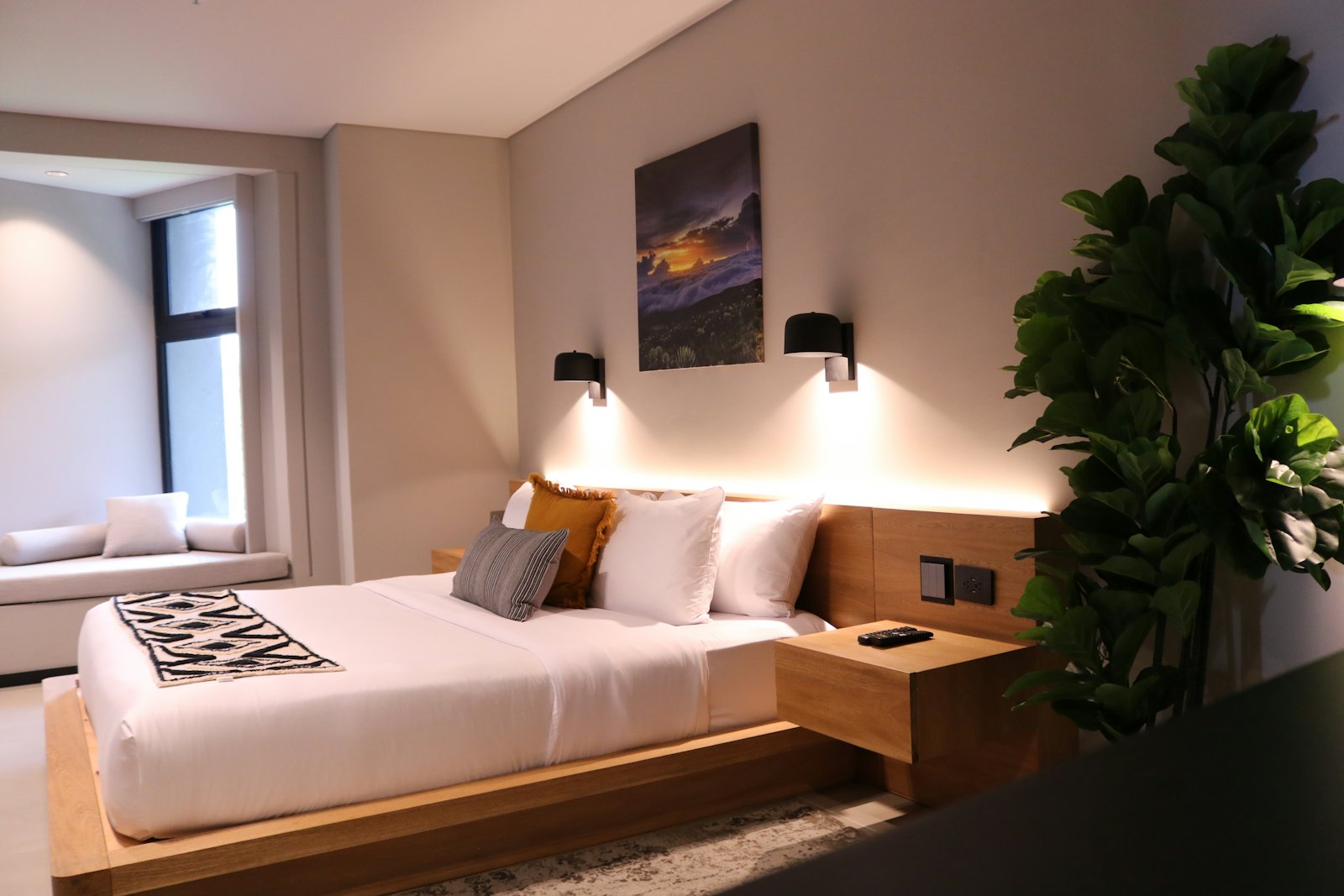 A warm bedroom with a low bed