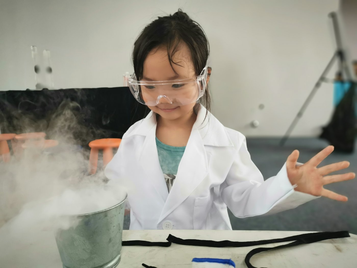 A young student doing a science experiment