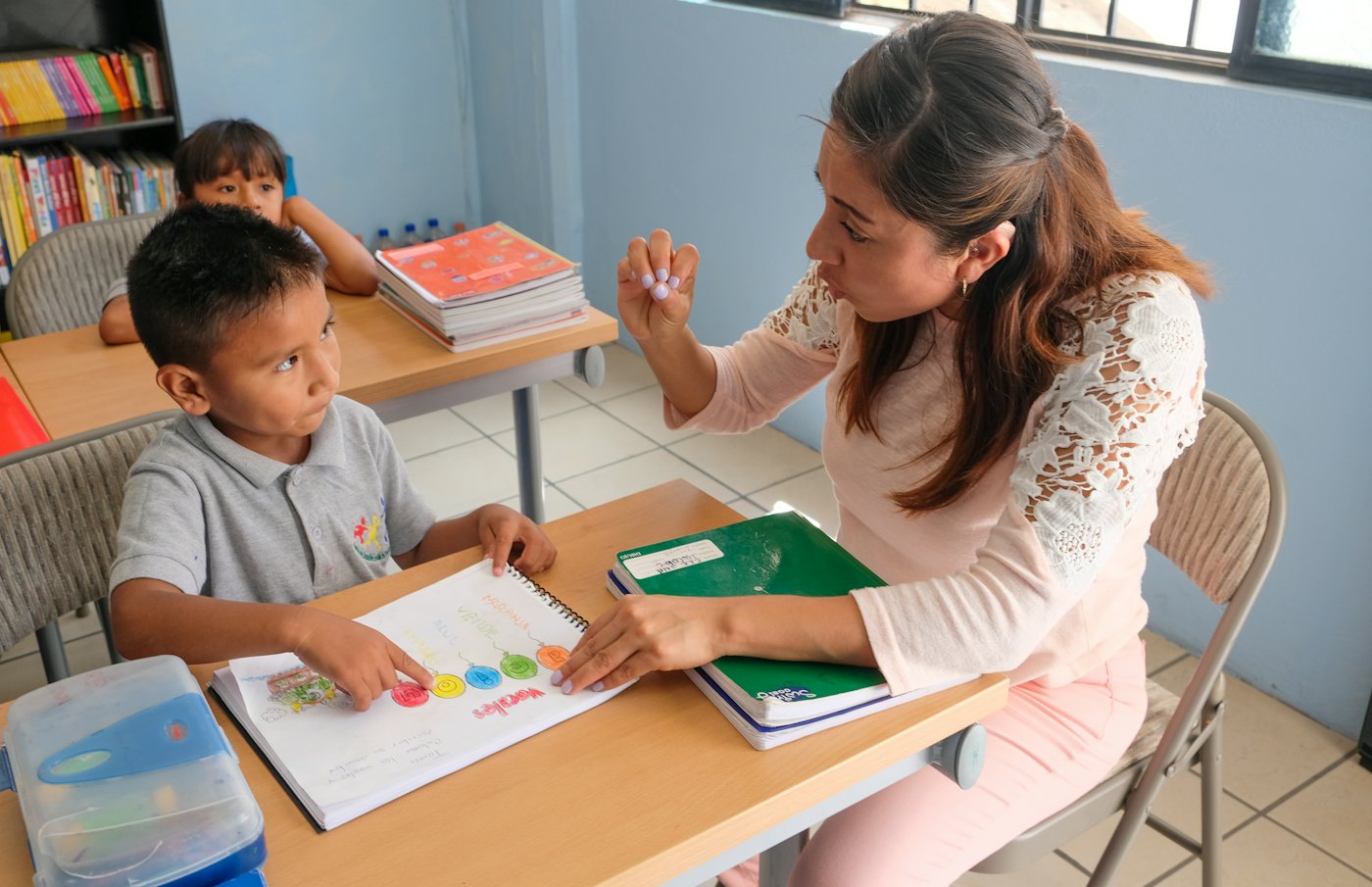 A tutor helping a young student