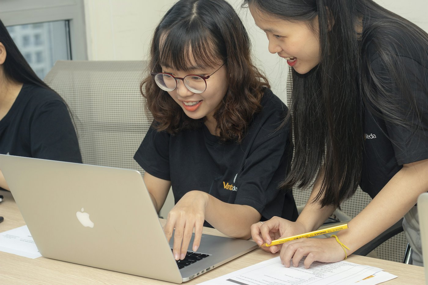 A tutor working through problems with students